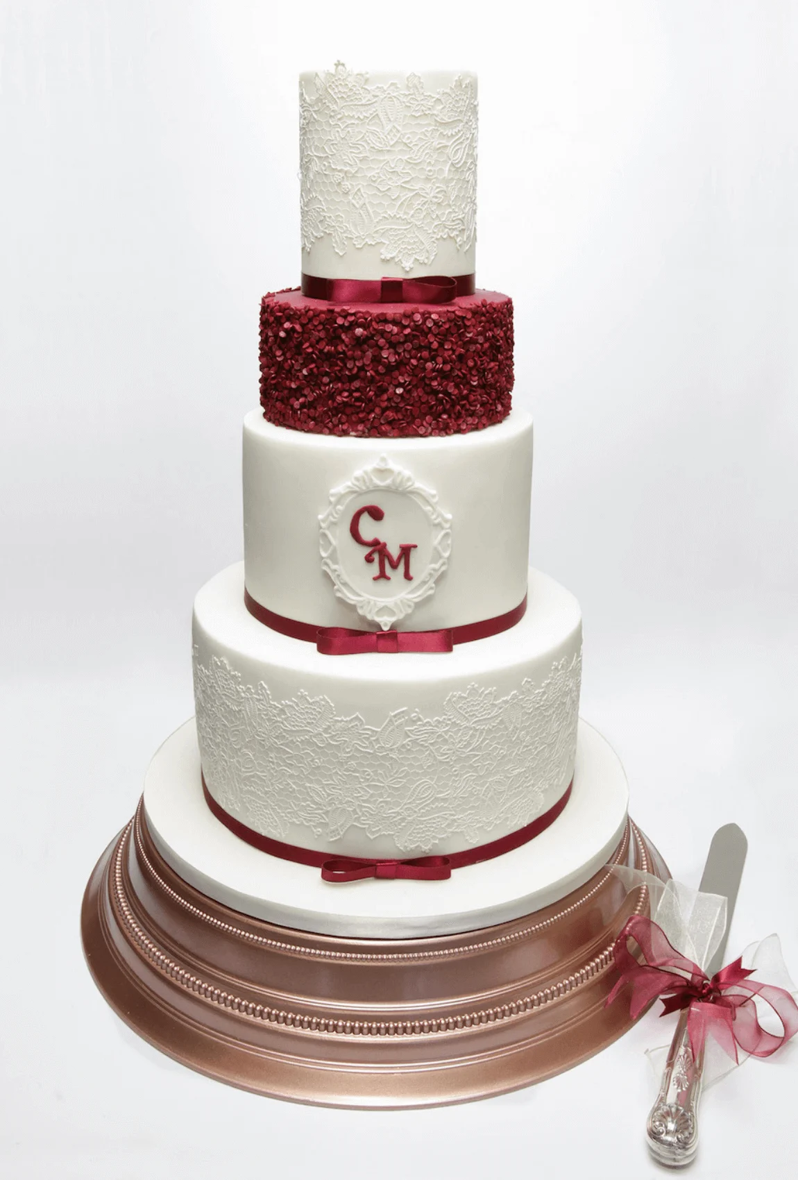 Elegant white bespoke wedding cake with floral details by Anne Robinson, a luxury cake designer in Cambridgeshire – Wedding Cake Design 2