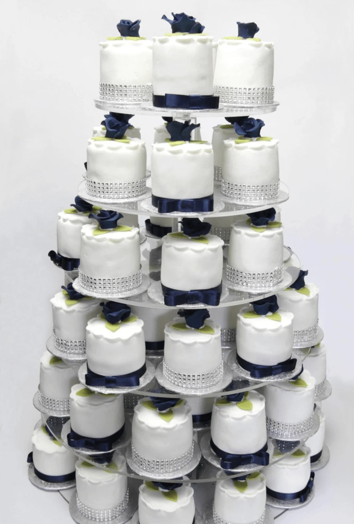 Elegant white bespoke wedding cake with floral details by Anne Robinson, a luxury cake designer in Cambridgeshire – Wedding Cake Design 21