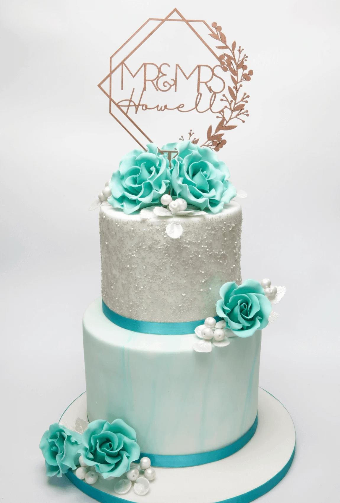 Elegant white bespoke wedding cake with floral details by Anne Robinson, a luxury cake designer in Cambridgeshire – Wedding Cake Design 3