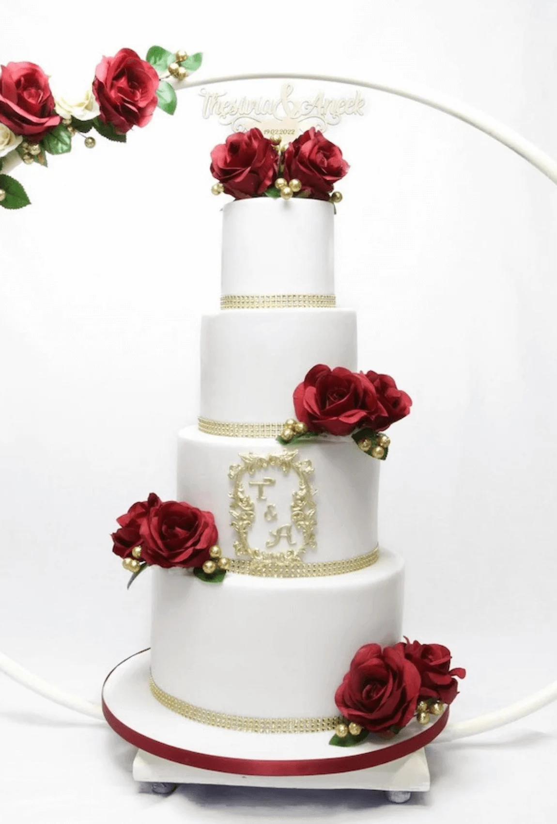 Elegant white bespoke wedding cake with floral details by Anne Robinson, a luxury cake designer in Cambridgeshire – Wedding Cake Design 17