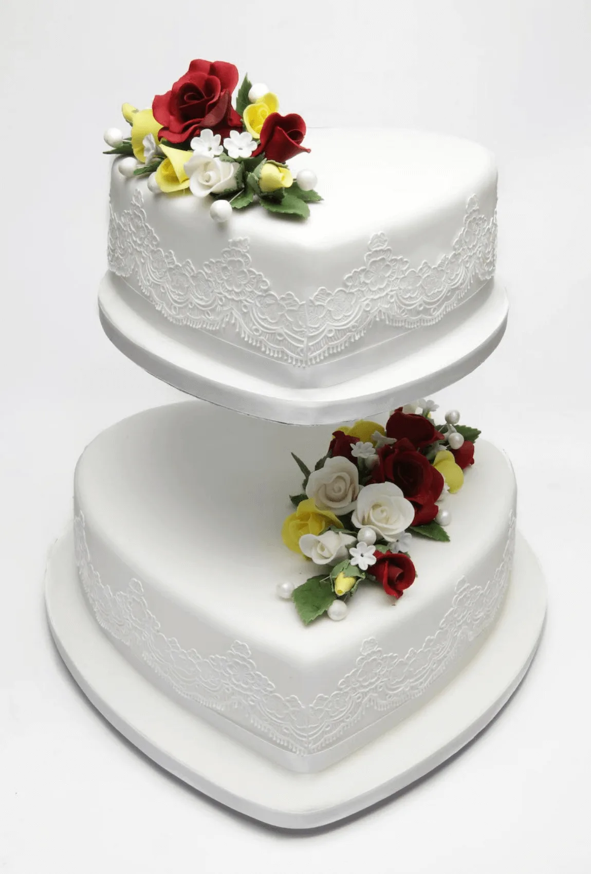Elegant white bespoke wedding cake with floral details by Anne Robinson, a luxury cake designer in Cambridgeshire – Wedding Cake Design 35