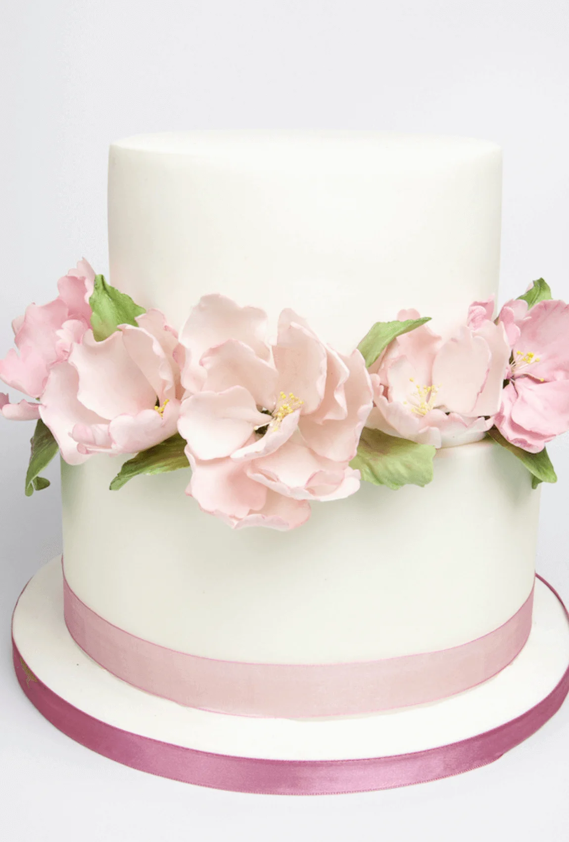 Elegant white bespoke wedding cake with floral details by Anne Robinson, a luxury cake designer in Cambridgeshire – Wedding Cake Design 32
