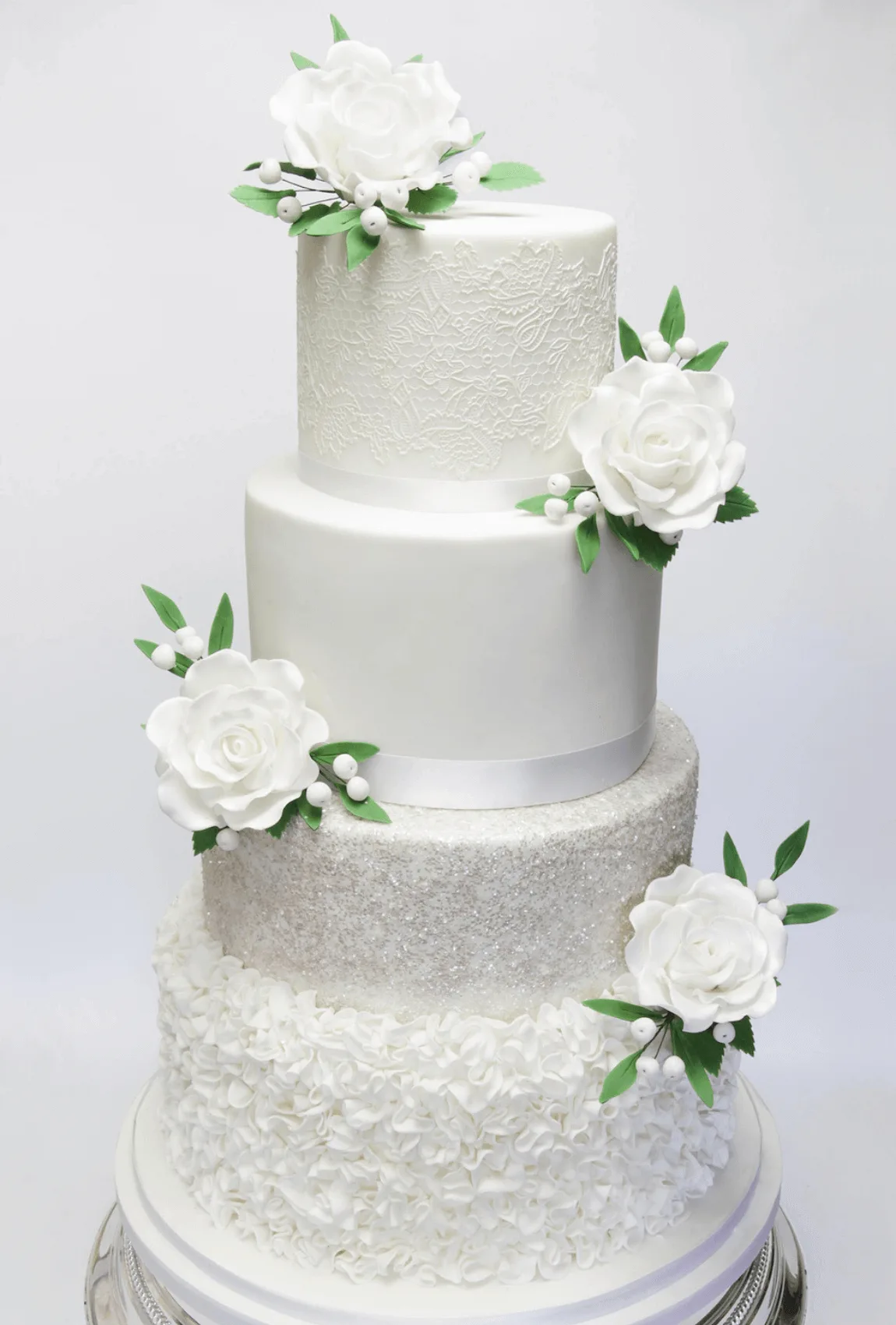 Elegant white bespoke wedding cake with floral details by Anne Robinson, a luxury cake designer in Cambridgeshire – Wedding Cake Design 12