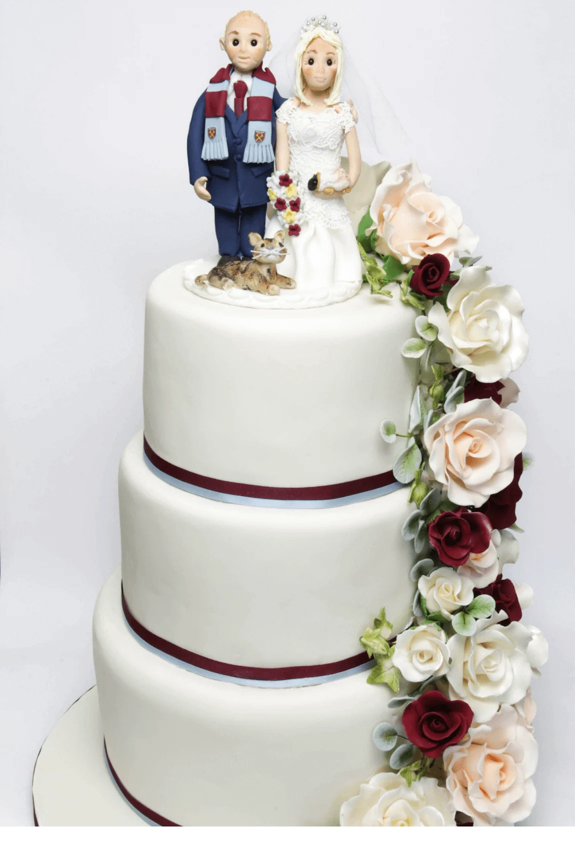 Elegant white bespoke wedding cake with floral details by Anne Robinson, a luxury cake designer in Cambridgeshire – Wedding Cake Design 33