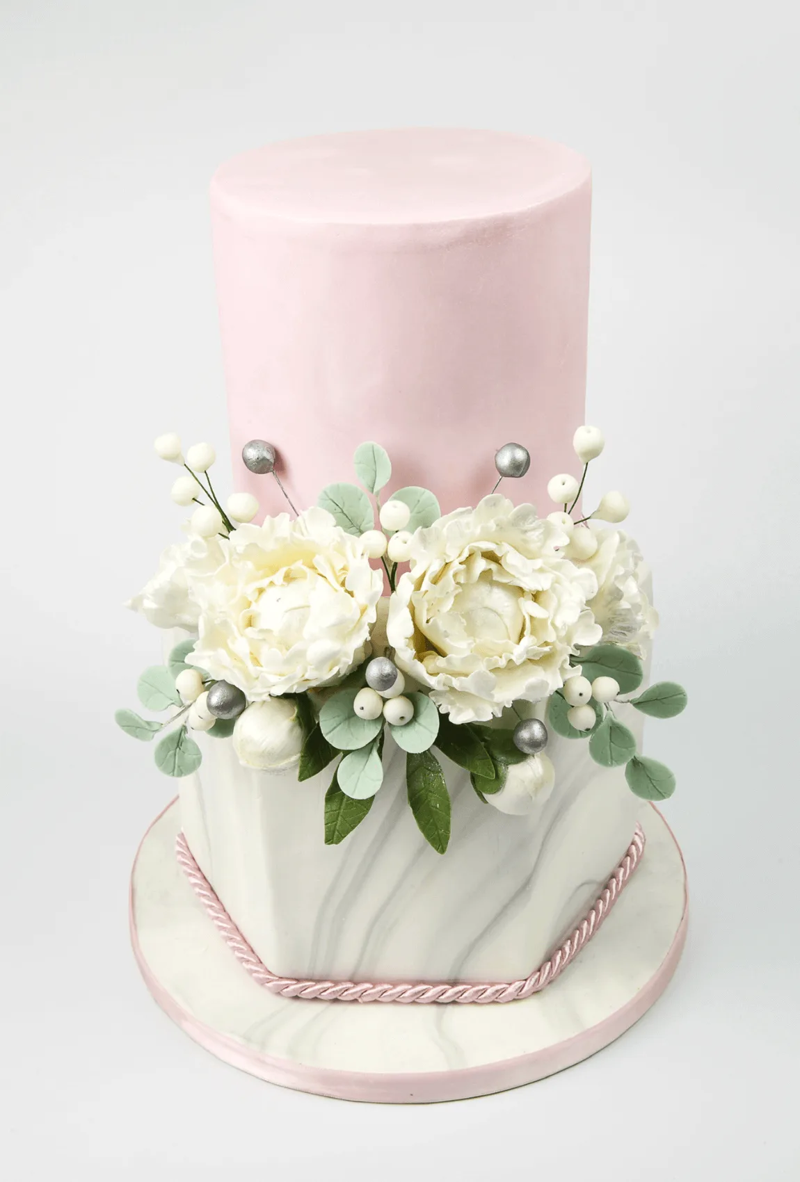 Elegant white bespoke wedding cake with floral details by Anne Robinson, a luxury cake designer in Cambridgeshire – Wedding Cake Design 25