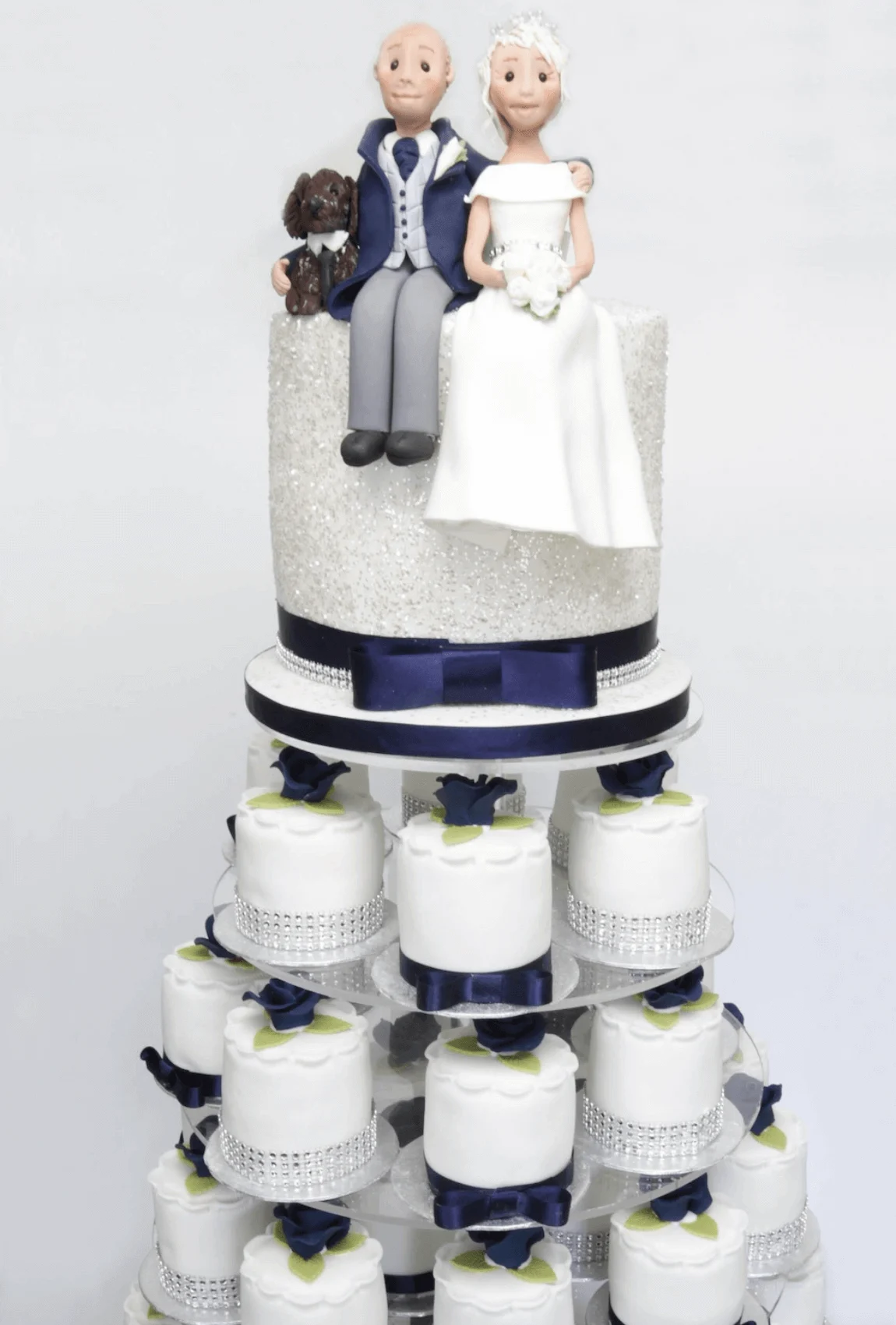 Elegant white bespoke wedding cake with floral details by Anne Robinson, a luxury cake designer in Cambridgeshire – Wedding Cake Design 26